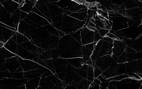 Black marble - Black Lacquer Design. For a dramatic statement in your kitchen, choose a veiny black quartz countertop. The engineered slabs used in this condo kitchen by Los Angeles-based Black Lacquer Design resembles luxurious Calacatta marble, but here's betting few will be able to tell the difference from afar. Continue …